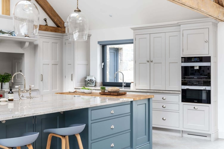 a-garage-kitchen-in-a-chic-contemporary-home-where-the-appliances-are-concealed-behind-sleek-handle-less-cabinets-creating-a-seamless-minimalist-appearance-2048x1366